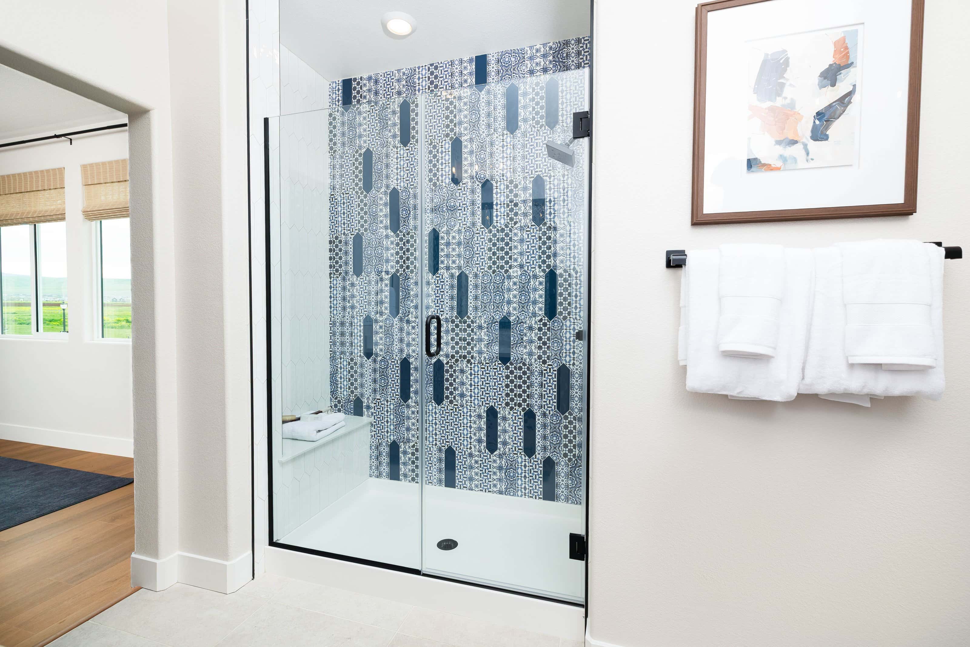 Full-view black handle frameless shower door installation
