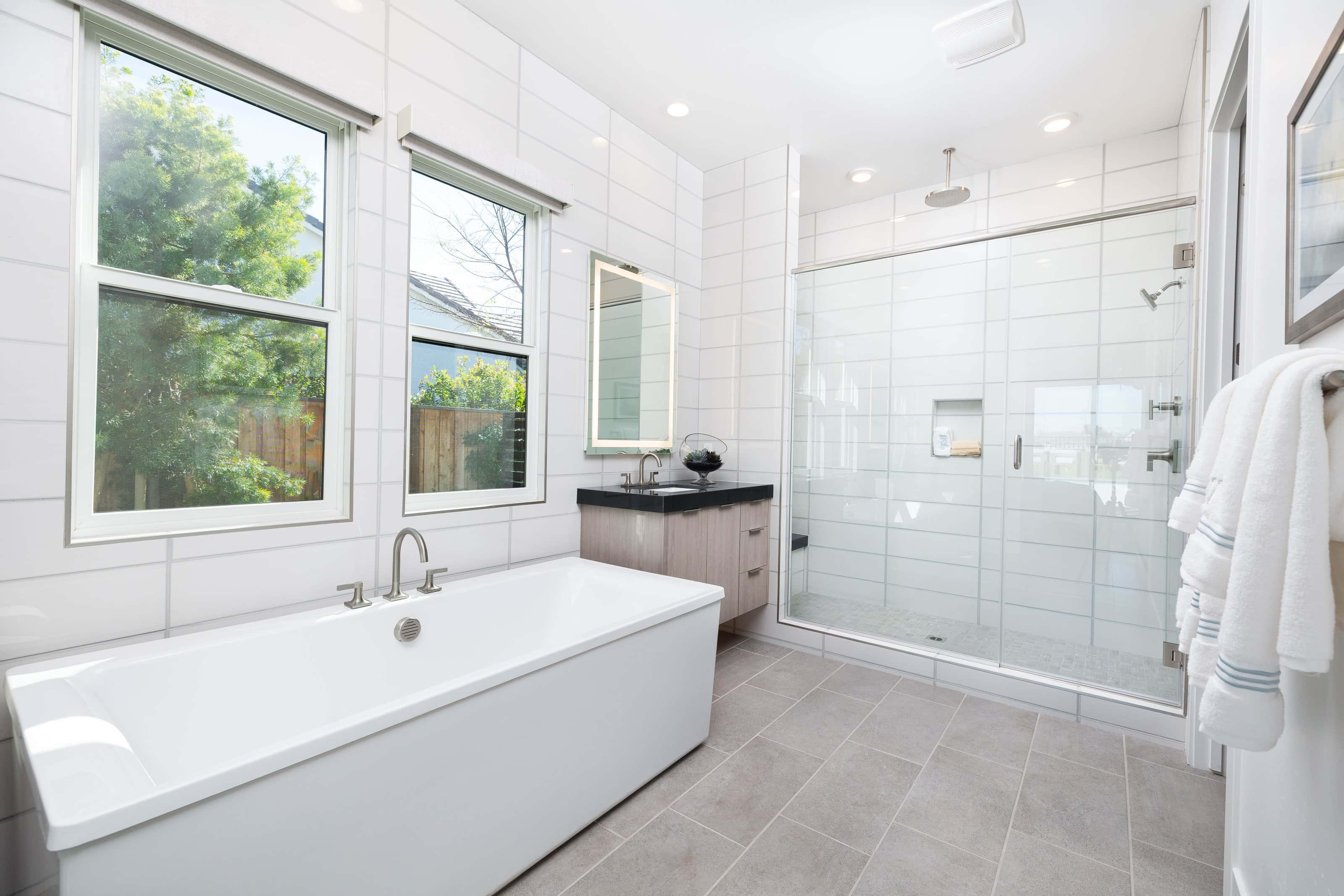 Luxury frameless shower enclosure with glass panels in a modern bathroom