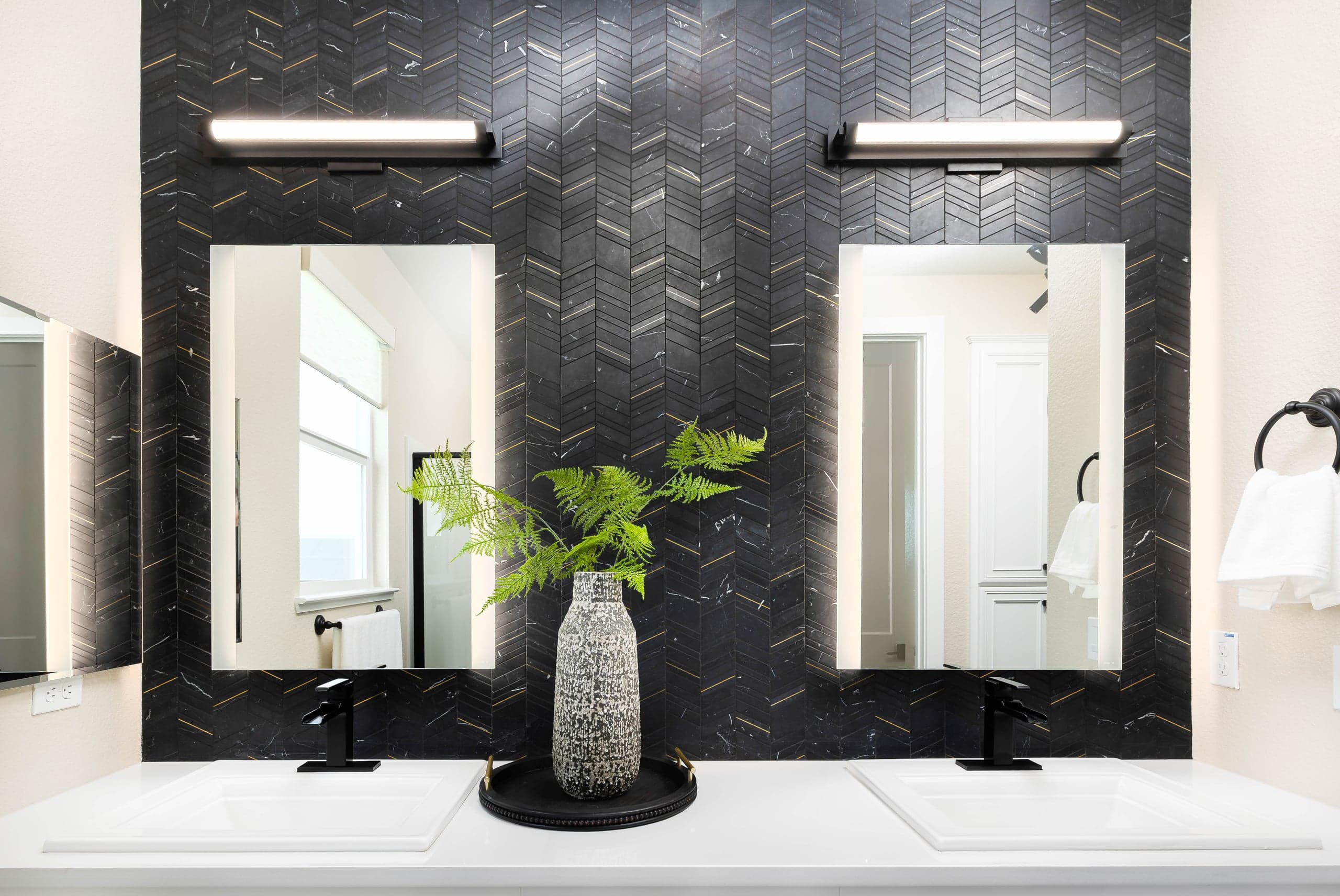 Full-bevel statement mirror in a Lewisville Castle Hills foyer, 6 feet wide with concealed French-cleat mounting