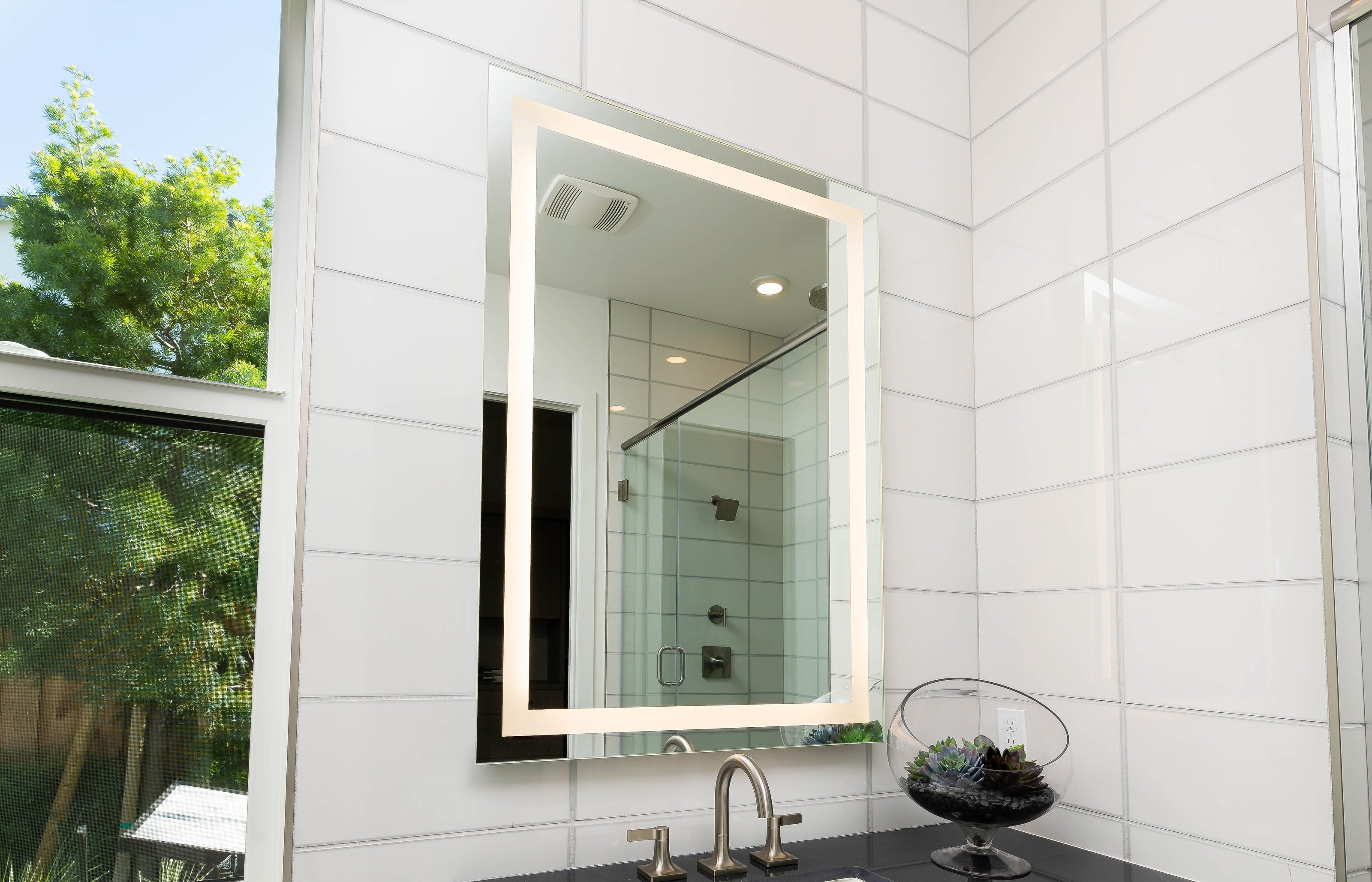 Custom framed wall mirror installation in a residential interior