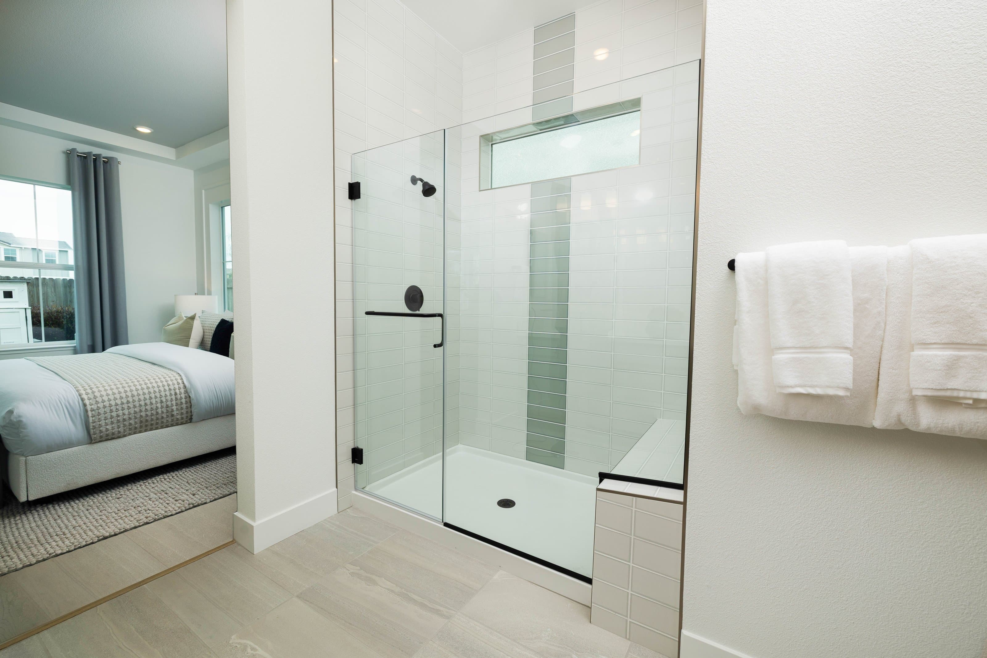 Frameless glass shower enclosure installed by Infinity Glass & Glazing