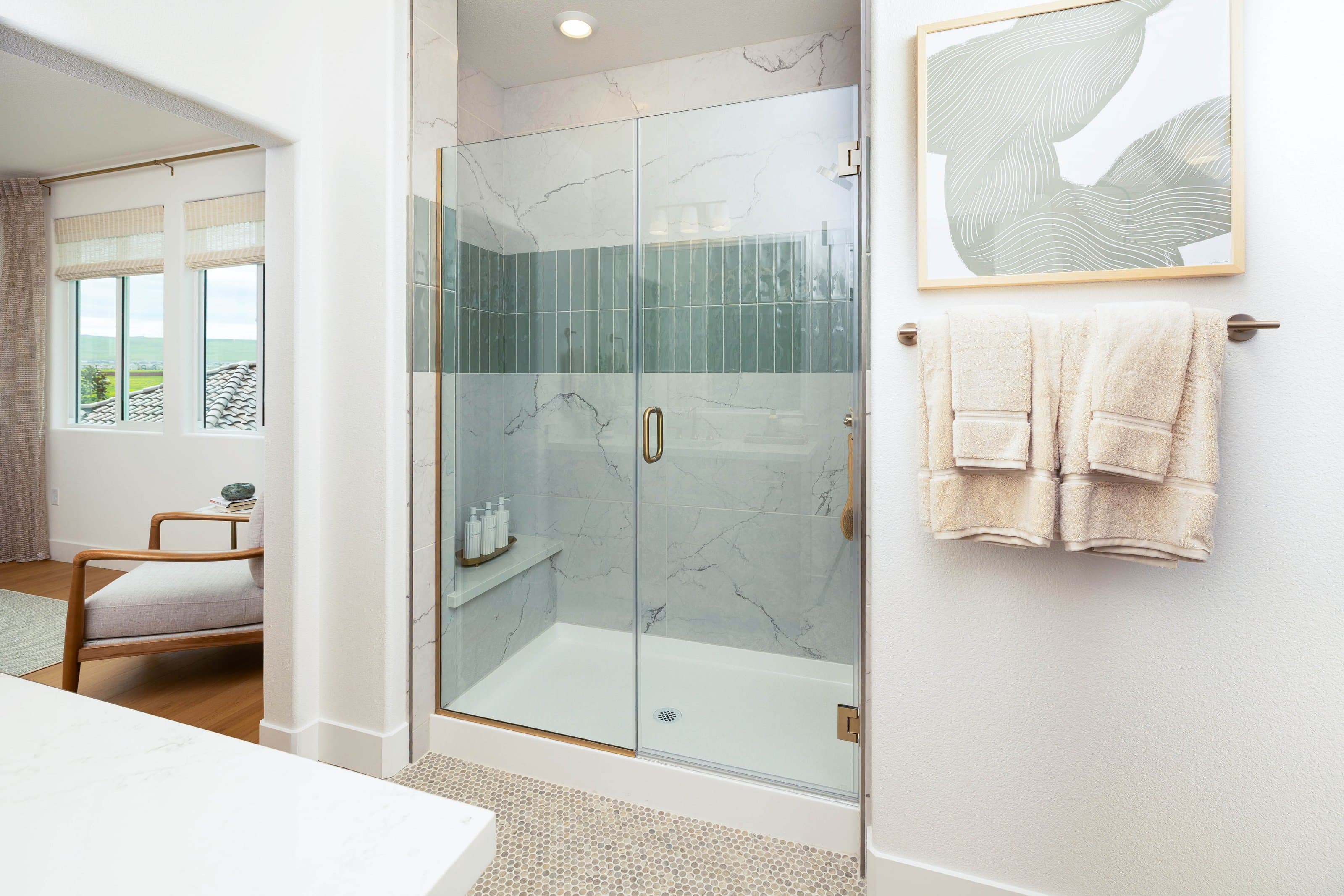 Frameless shower enclosure replacing a 1990s framed unit in a Corinth Lake Sharon home with brushed nickel hardware